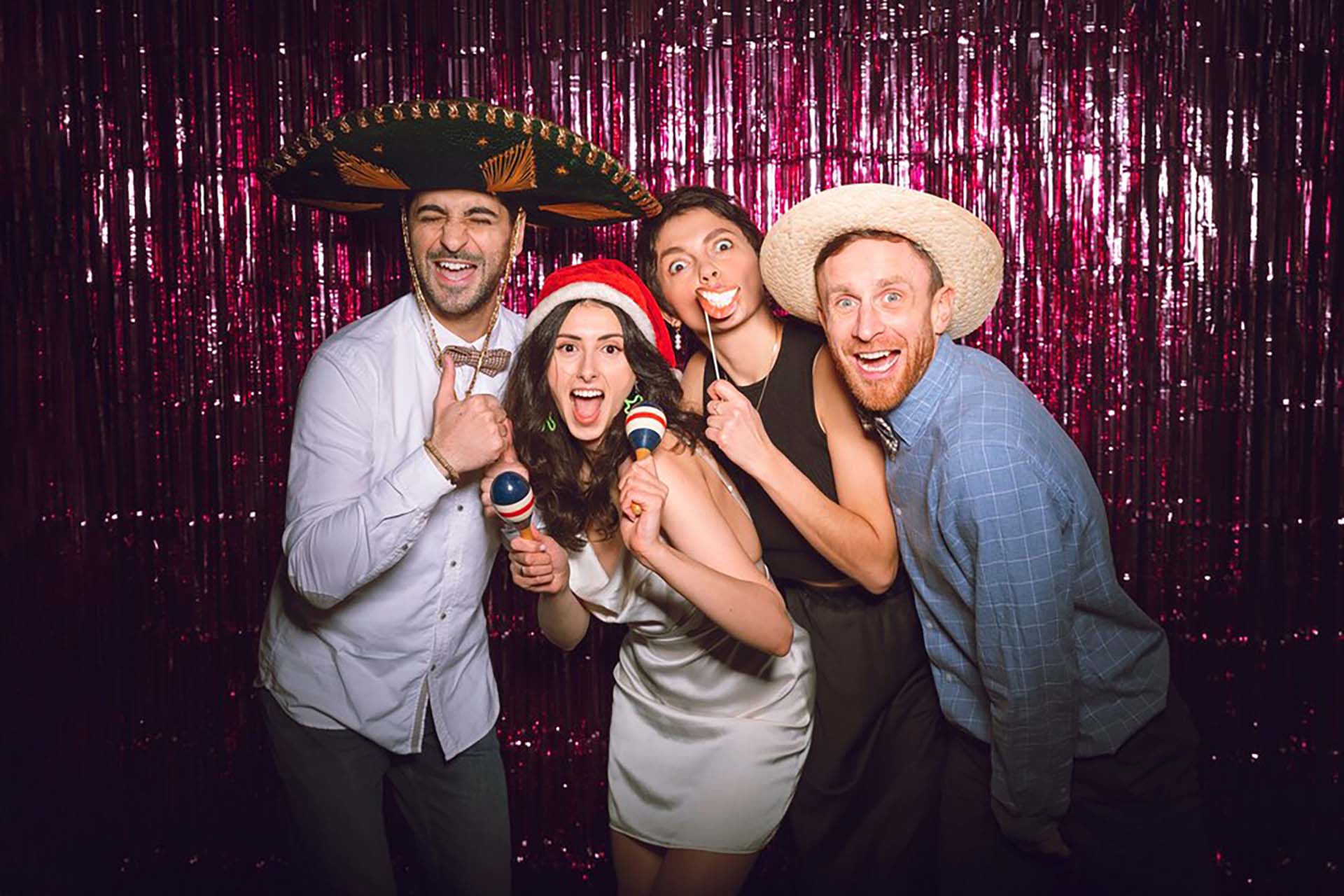medium-shot-friends-posing-together-photobooth_23-2150171650